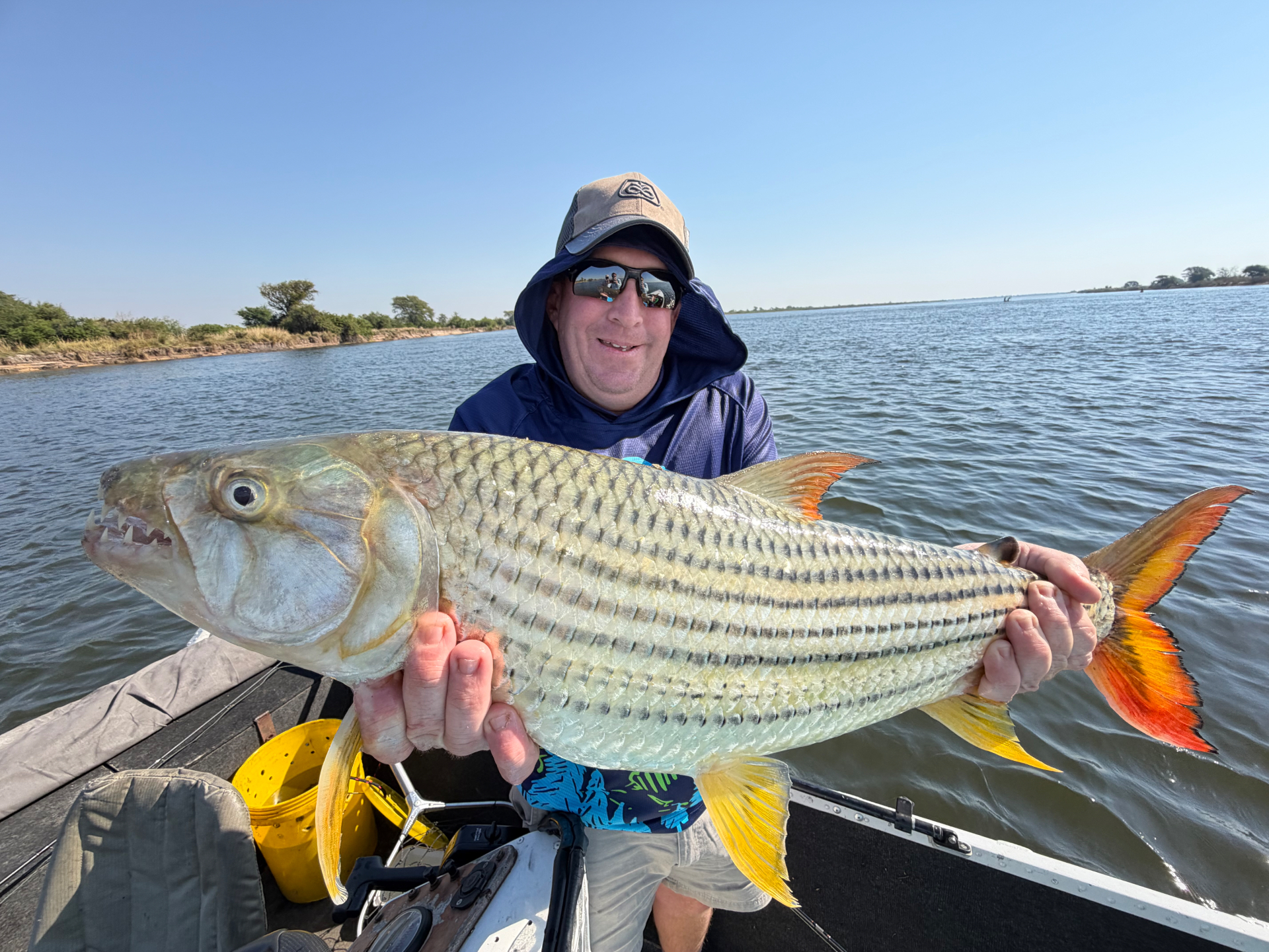 Tim on the board with a 15 lb tiger